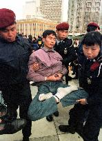 Falun Gong member removed by Macao police